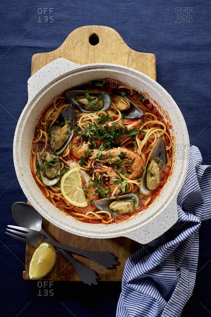 Top view of seafood pasta with shrimps, mussels and tomato sauce