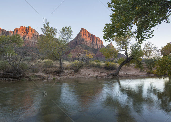 View from the Pa'rus Trail across the Virgin River to the Watchman at sunset, autumn, Zion National Park, Utah, United States of America, North America