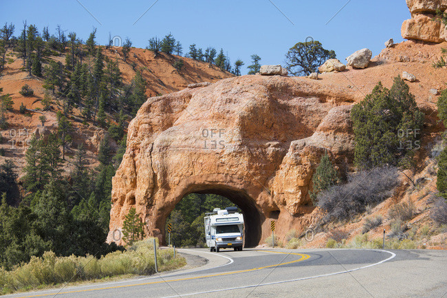 October 20, 2017: Motorhome emerging from red rock tunnel on Utah State Route 12, Red Canyon, Dixie National Forest, Utah, United States of America, North America