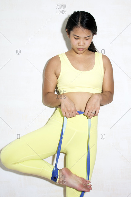 Contortionist using a resistance band