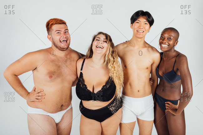 Friends laughing together, wearing underwear