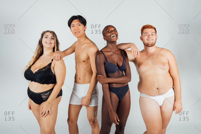 Confident friends together, wearing underwear stock photo - OFFSET