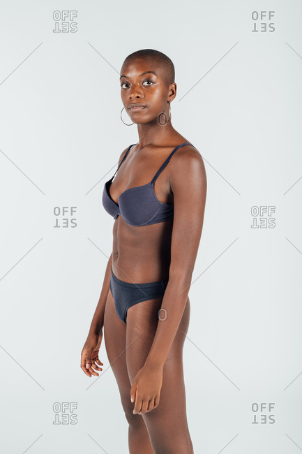Portrait of a young woman wearing underwear stock photo - OFFSET