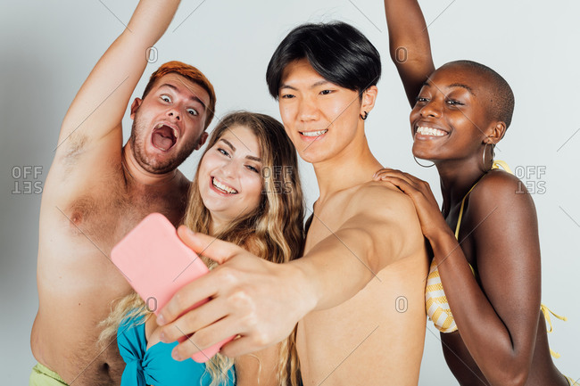Friends taking a selfie, partially clothed
