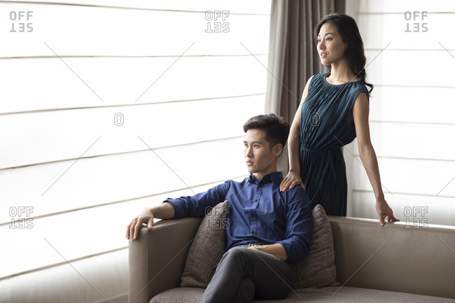 Happy young couple relaxing in living room