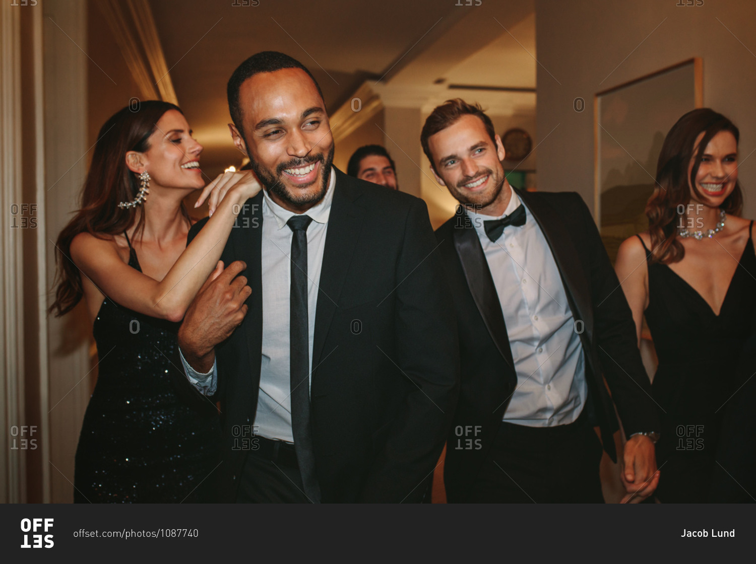 Diverse group of people at a party. Multi-ethnic friends having fun together at a gala event.