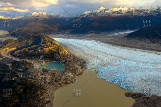 Aerial photo of a sprawling glacier in the wilderness of Patagonia Chile.