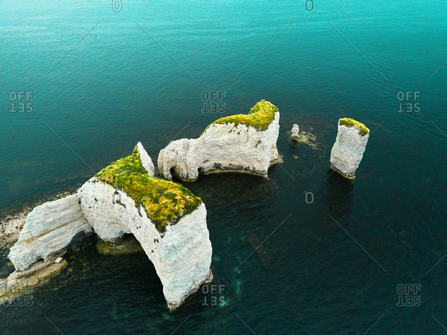 Aerial view of the iconic landmark of Old Harry Rocks and its white cliffs made of chalk in Studland, Dorset, United Kingdom.