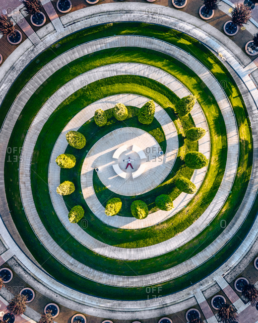 Aerial view of hypnotizing geometric lines of Krasnodar park from above with a lie down man in the middle of this construction, Krasnodar, Russia