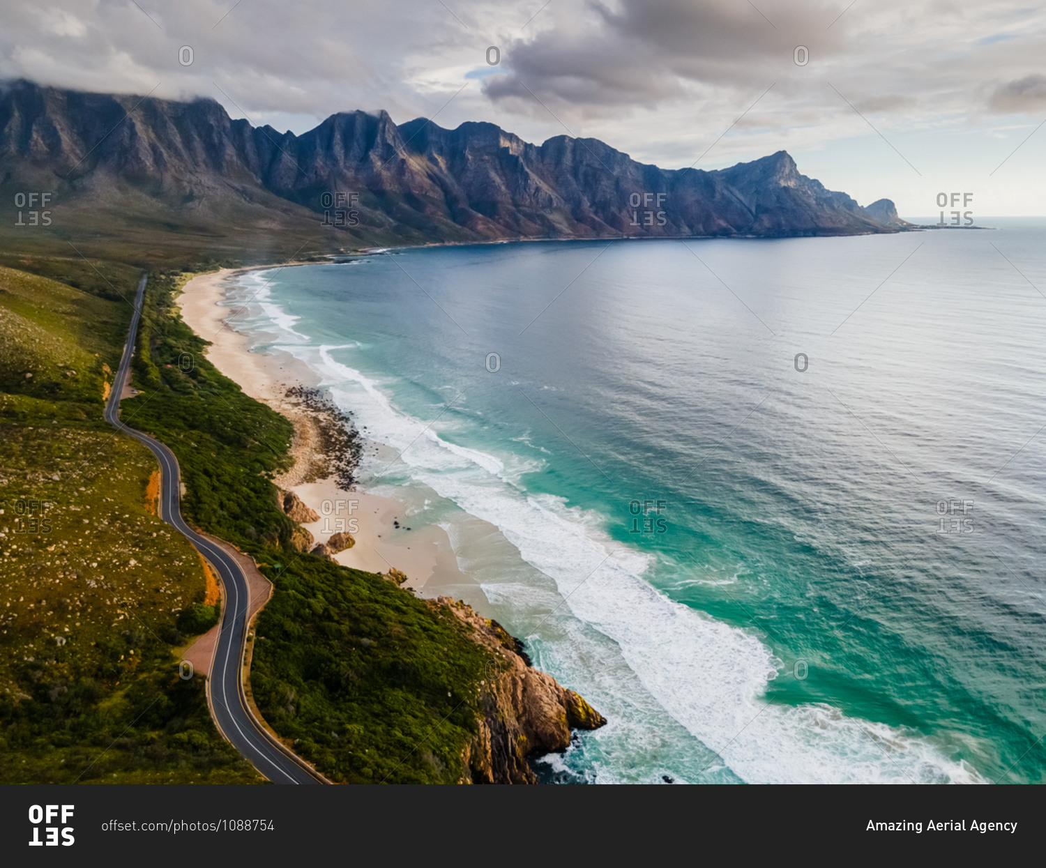 Aerial view of scenic coastal drive Clarens Drive and Kogel Bay beach, between Gordon\'s Bay and Rooi Els, after rain storm, Cape Town, South Africa