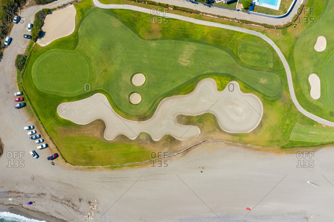 Aerial view of golf course on coast, Atalaya Isdabe, Malaga, Spain