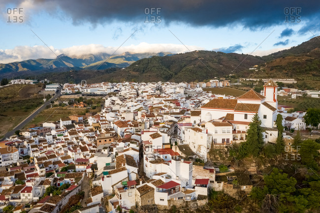 Aerial view of city center with church in Alozaina, Malaga, Spain