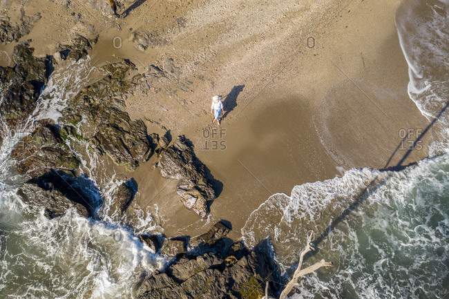 Aerial view of woman in chair on beach in Benalmadena, Malaga, Spain