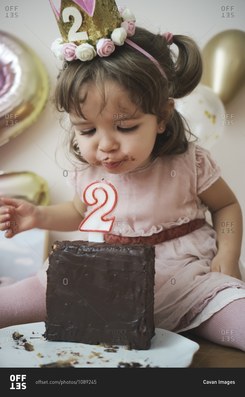 a-2-year-old-girl-celebrating-her-birthday-stock-photo-offset