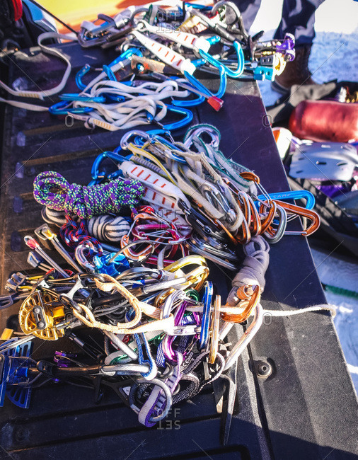 A pile of rock and ice climbing gear on a truck tailgate