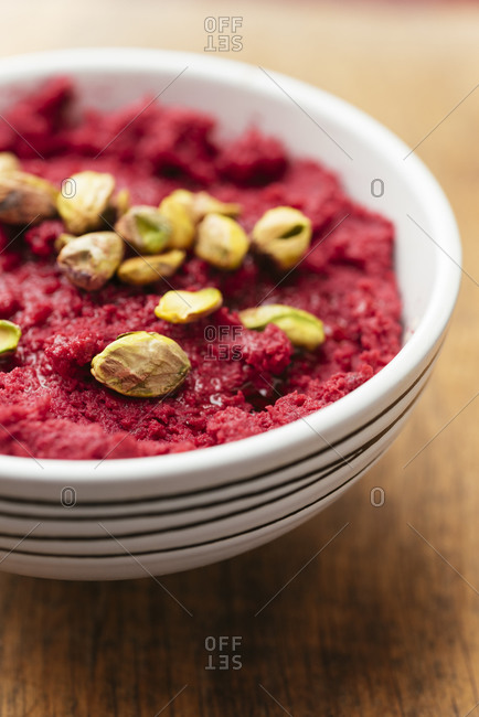 Roasted beetroot hummus garnished with pistachios