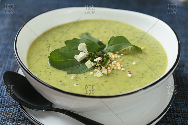 Home made broccoli and arugula soup, garnished with puffed quinoa