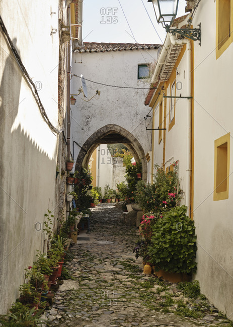 Old cobble stone lined village street in Castelo De Vide