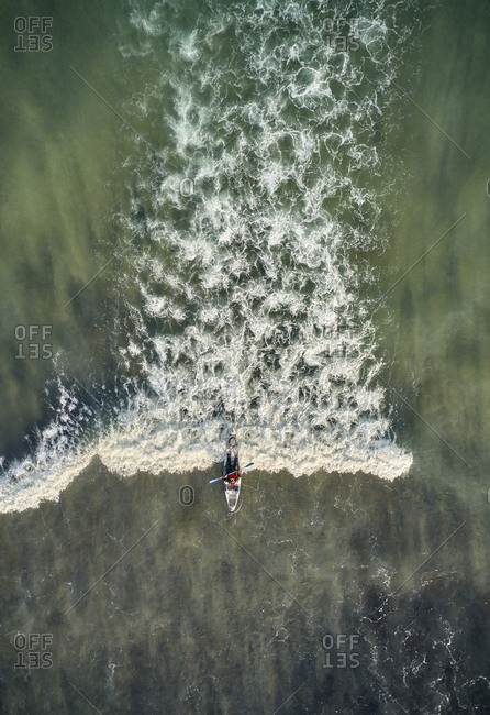 Foamy wave and kayaker from drone