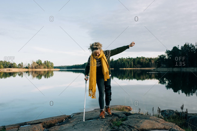 injured woman walking along the coast in beautiful Sweden