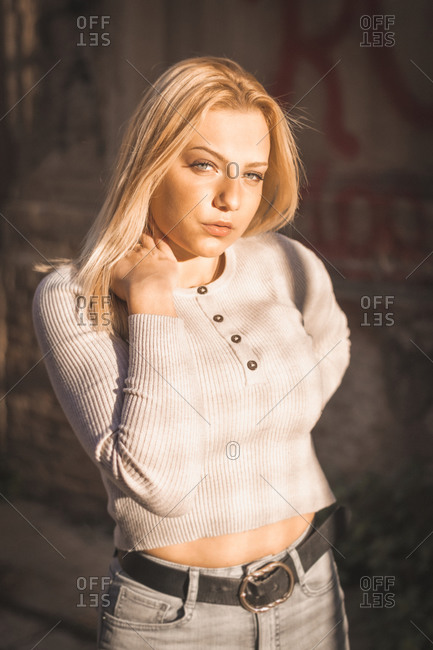 Blonde Girl With Seductive Look On The Street At Sunset