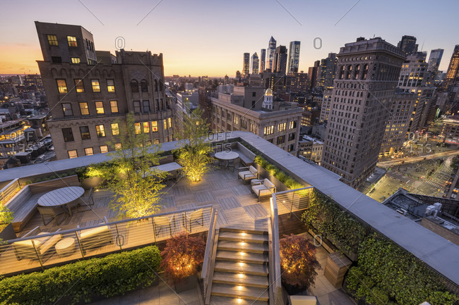 New York, New York - May 21, 2019: A large roof deck with views of Hudson Yards.