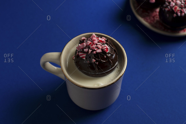 Hot chocolate bomb in mug of hot milk