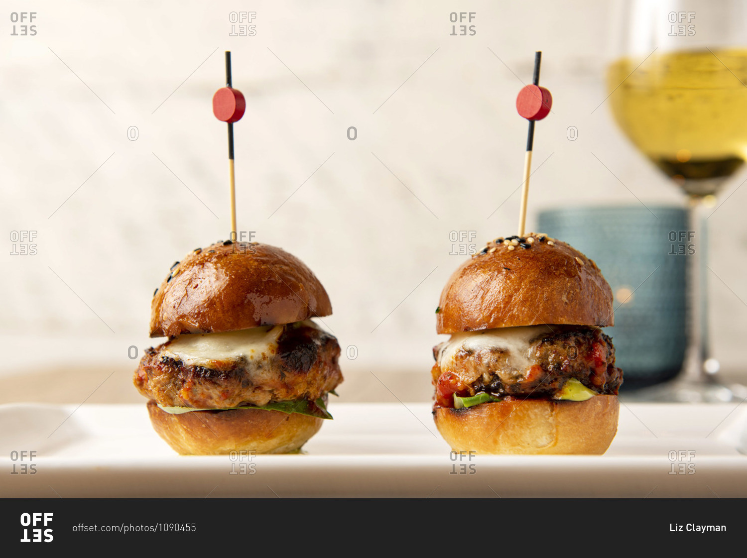 Two octopus slider burgers on white plate
