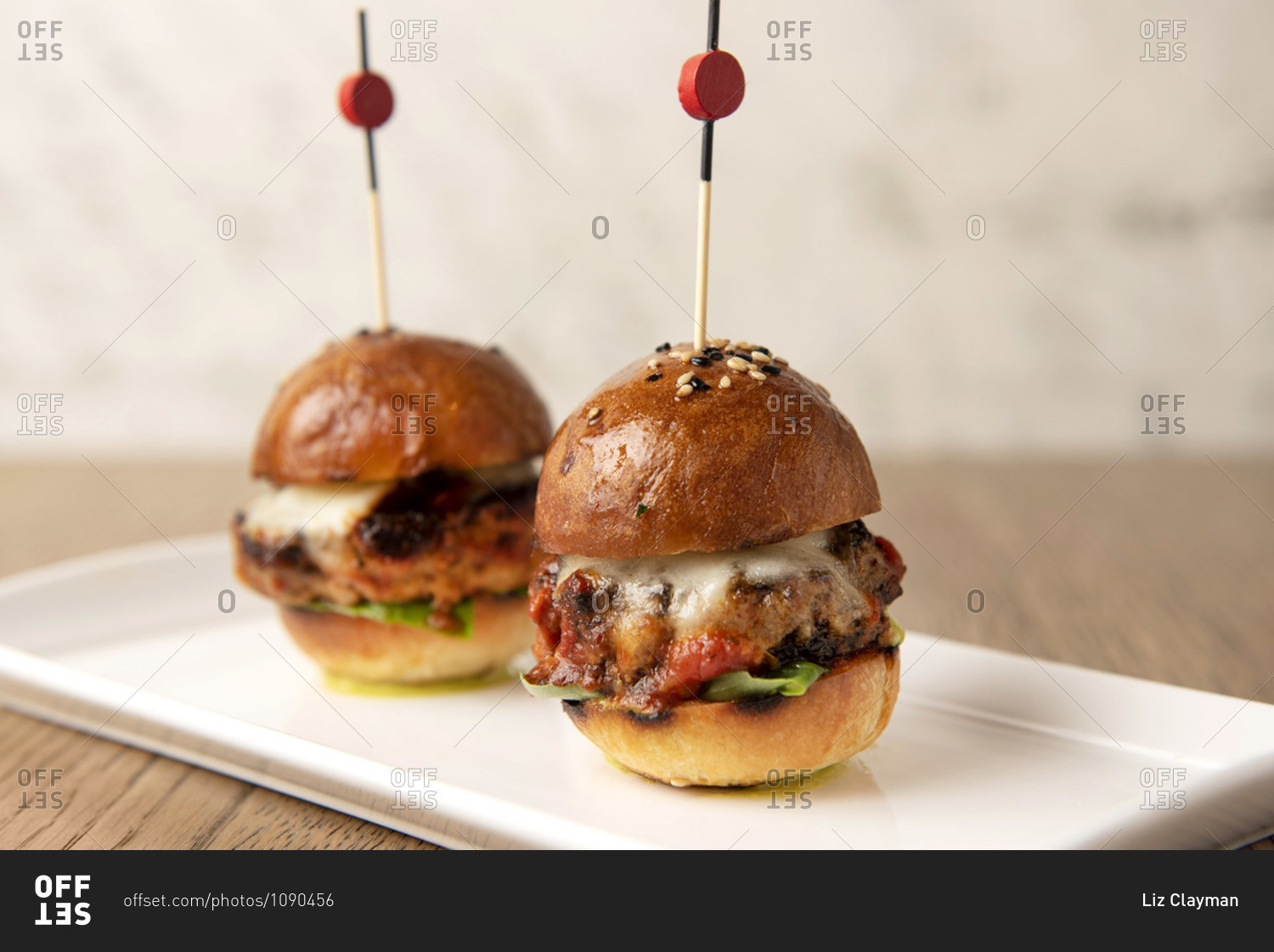 Close up of two octopus slider burgers on white plate