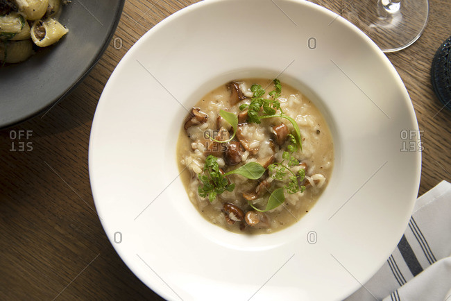 Overhead view of mushroom risotto in a large bowl