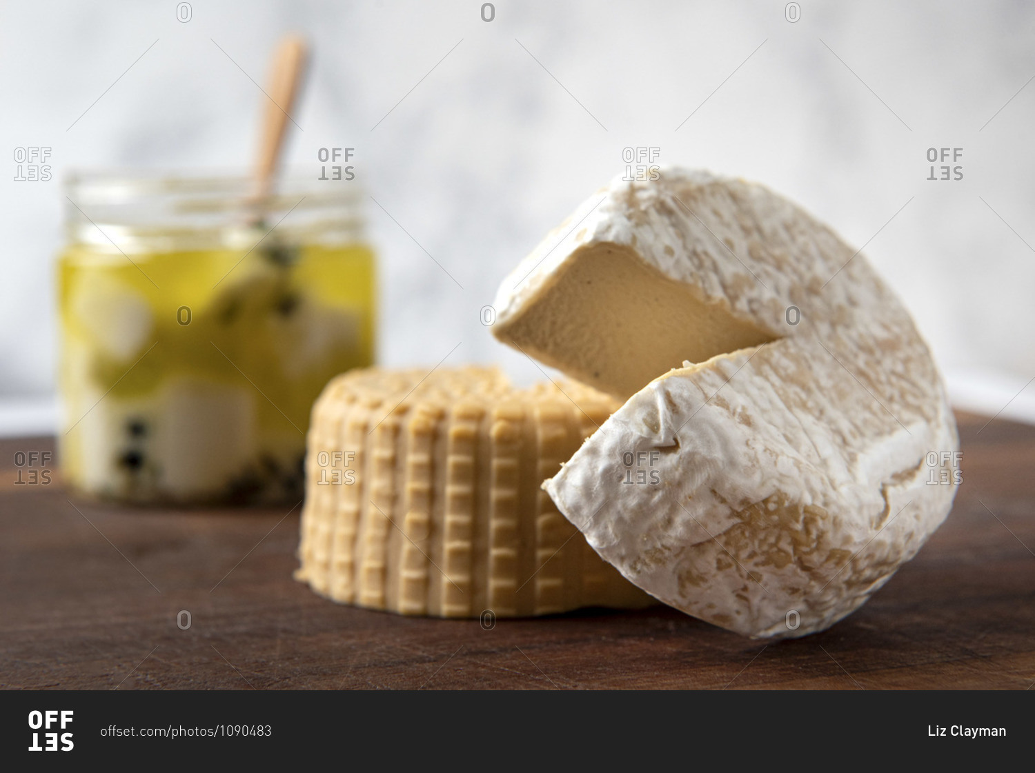 Variety of plant based, dairy free cheeses on wooden board