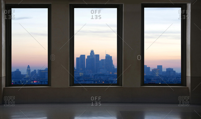 View of the Los Angeles downtown skyline seen through three large windows, California