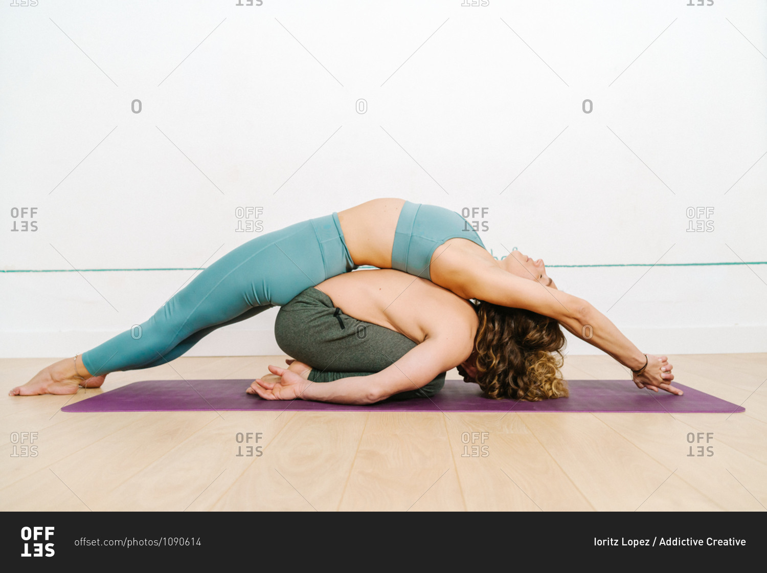Side View Of Flexible Couple In Activewear Practicing Acroyoga In Balasana And Matsyasana On Mat In Bright Studio Stock Photo Offset