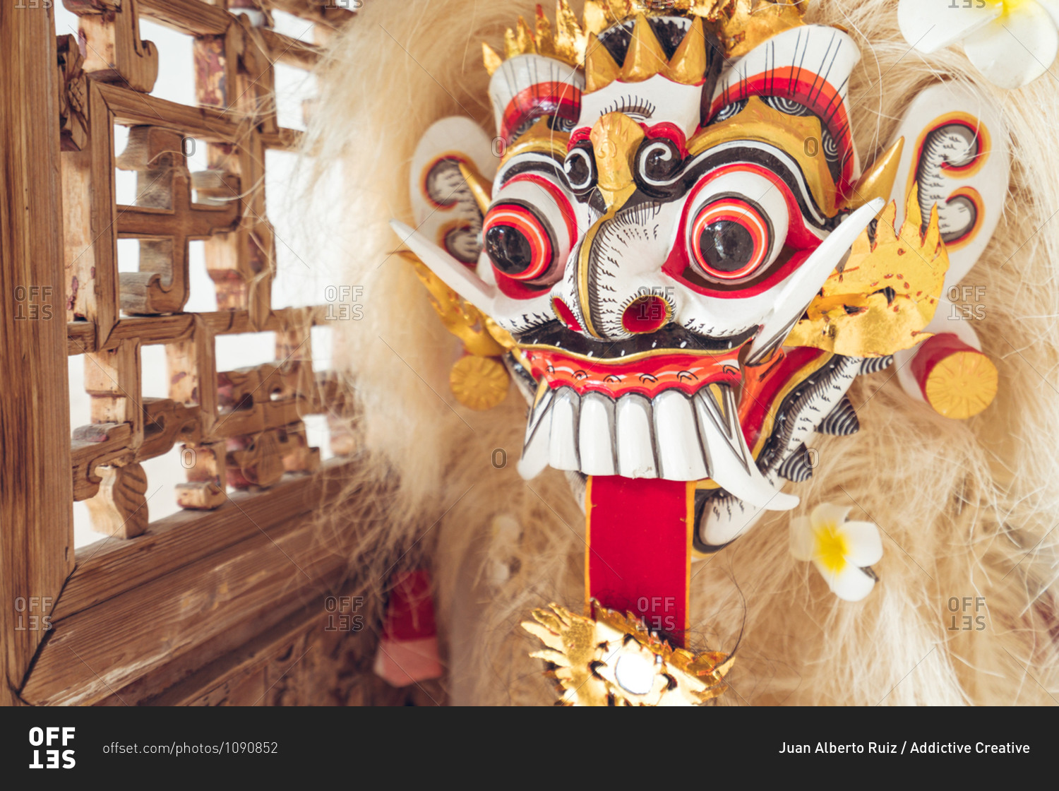 Authentic Asian lion figure with fur and colorful ornament on face used during cultural and religious celebrations and symbolizing luck and fortune placed in hotel in Taiwan