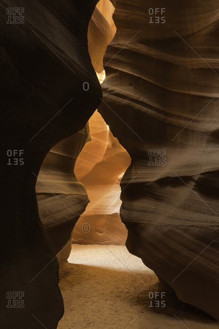 Low angle of spectacular view of Antelope Canyon with smooth brown surface located in Arizona