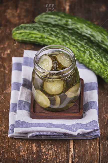 Vegan food, pickled cucumber in crystal jar