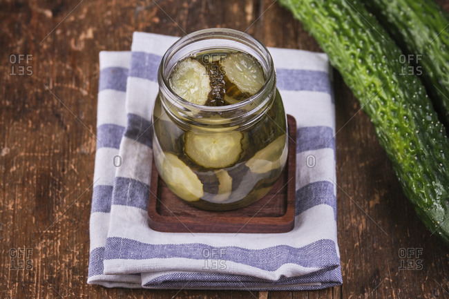 Vegan food, pickled cucumber in crystal jar