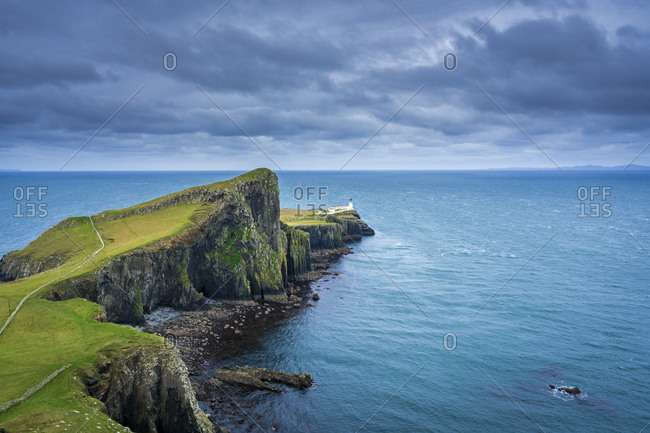 Distant view of neist point lighthouse, isle of skye, scotland, uk