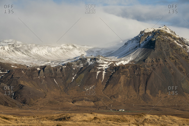 Scenic view of snowcapped mountains against cloudy sky, budir, snaefellsnes peninsula, iceland