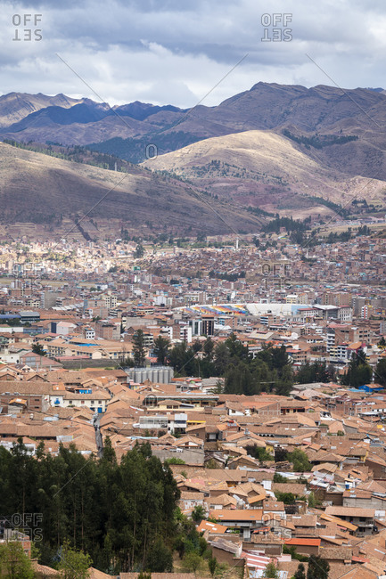 Elevated view of cusco city with mountains in background, peru