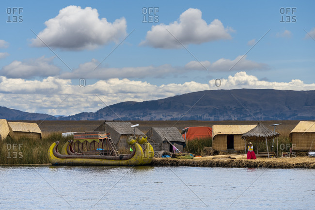 Puno, puno, peru - october 14, 2018: boat made of reed at uros islands, lake titicaca, peru