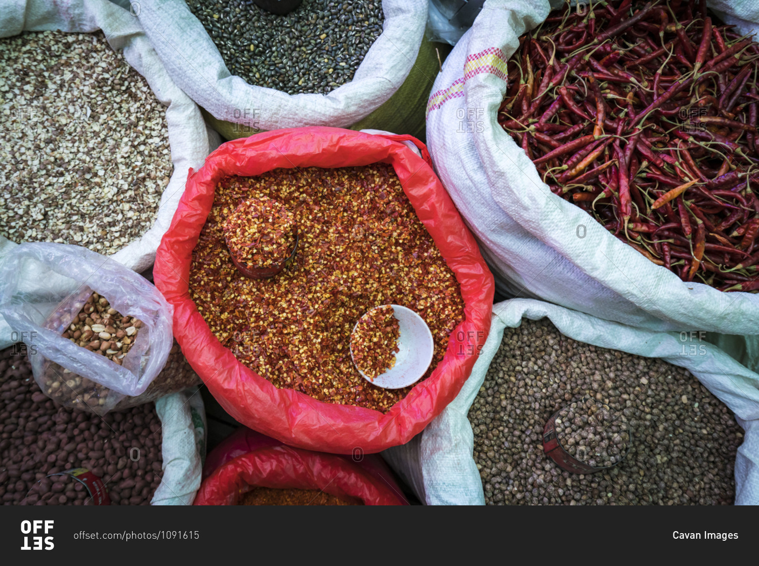 Overhead view of seeds and red chili peppers for sale at market, nyaungshwe, lake inle, myanmar