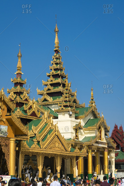 Yangon, yangon region, myanmar (burma) - january 28, 2018: exterior of buddhist temple against clear blue sky at shwedagon pagoda complex, yangon, myanmar