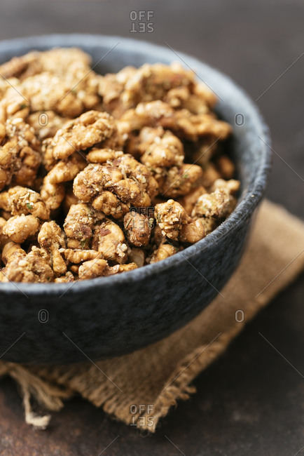 Toasted walnuts with vegan parmesan, herbs and spices as healthy snack