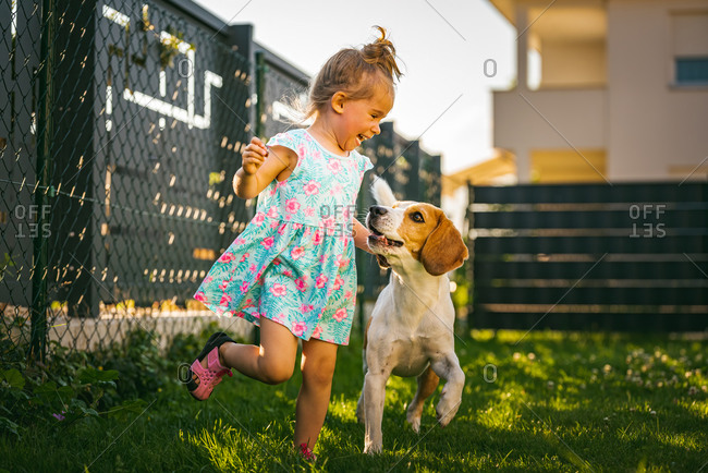 Kids Boy and Girl Playing in The Garden with Animals on Summer