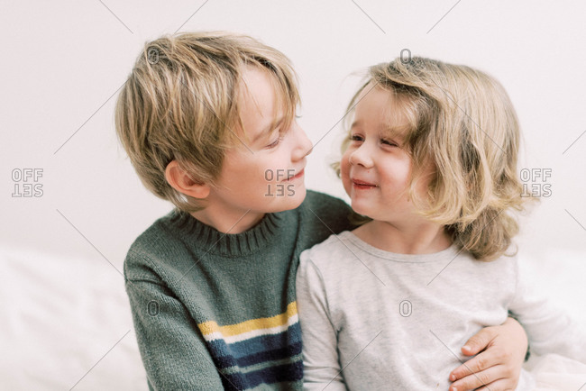 A brother and sister sharing a sweet and happy moment