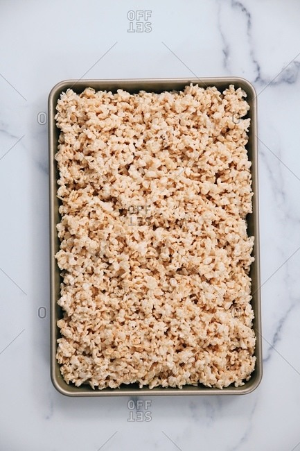 Baking sheet filled with marshmallow rice cereal treats