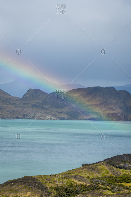 Scenic view of rainbow over lake nordenskjold, Torres del paine national park, Patagonia, chile