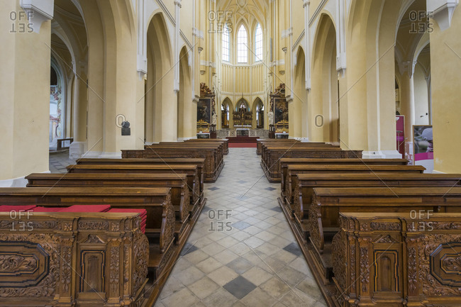 Czechia, central bohemian region, kutna hora - october 5, 2016: benches in empty church of the assumption of our lady and saint john the baptist, kutna hora, Czech republic