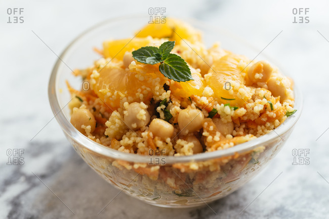 Salad with couscous, tangerines, orange, chickpeas, parsley and mint